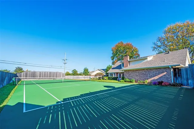 a view of yard with swimming pool and green space