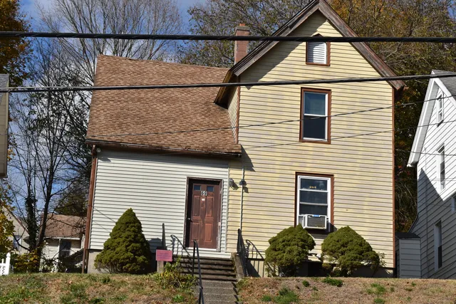 a view of house that has a street