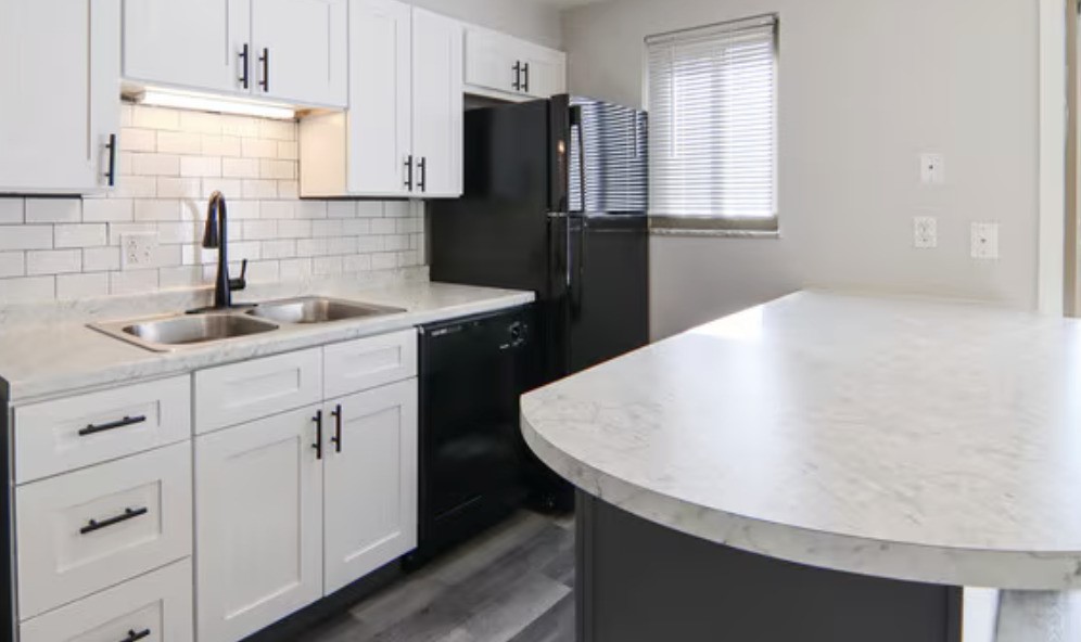 1 Gardner Court Markle, IN 46770 - Photo 5 of 6 a kitchen with a sink dishwasher a refrigerator with white cabinets and wooden floor