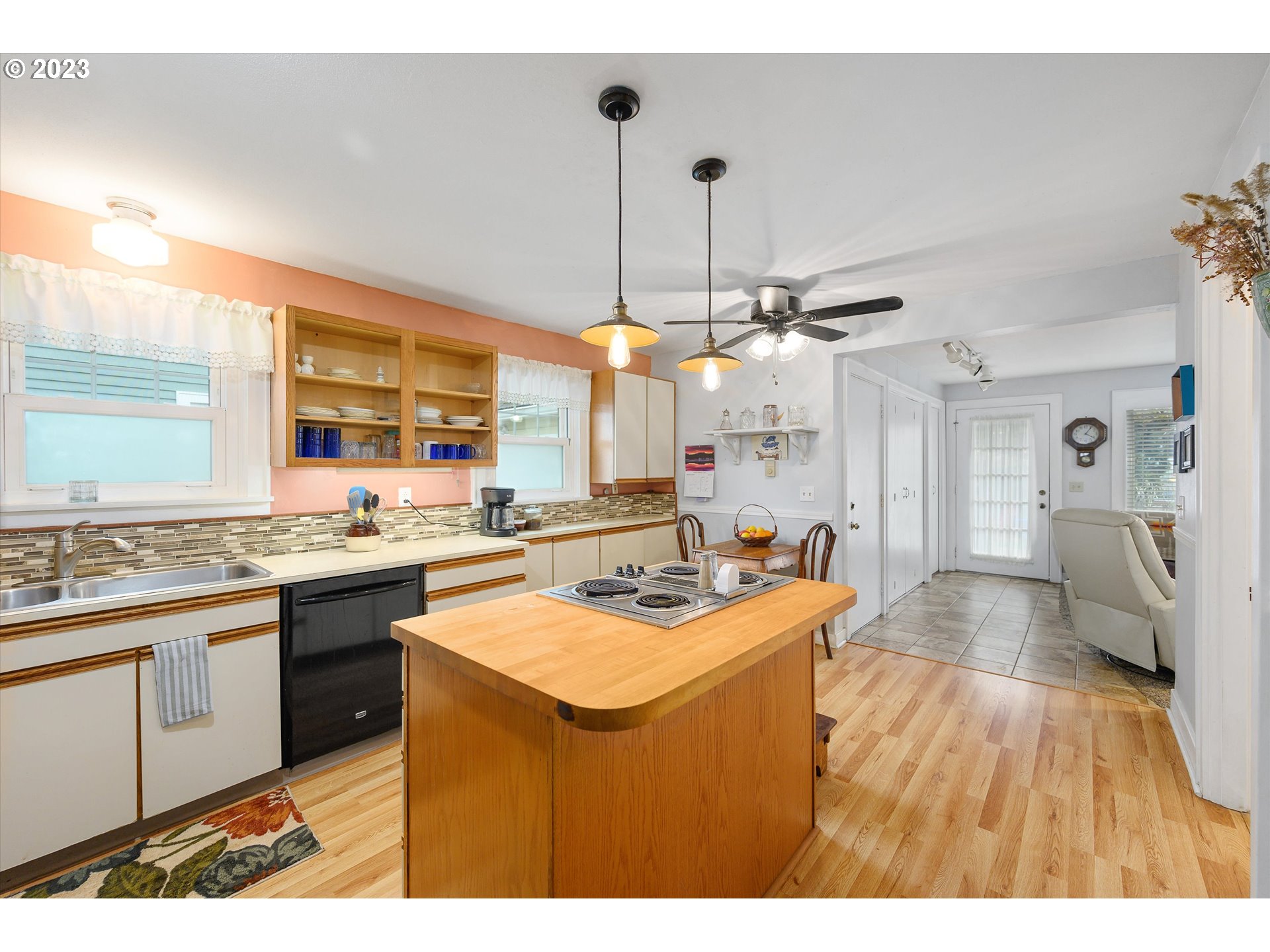 553 Southwest Clay Street Dallas, OR 97338 - Photo 12 of 33 a kitchen with stainless steel appliances granite countertop a sink a stove and a refrigerator