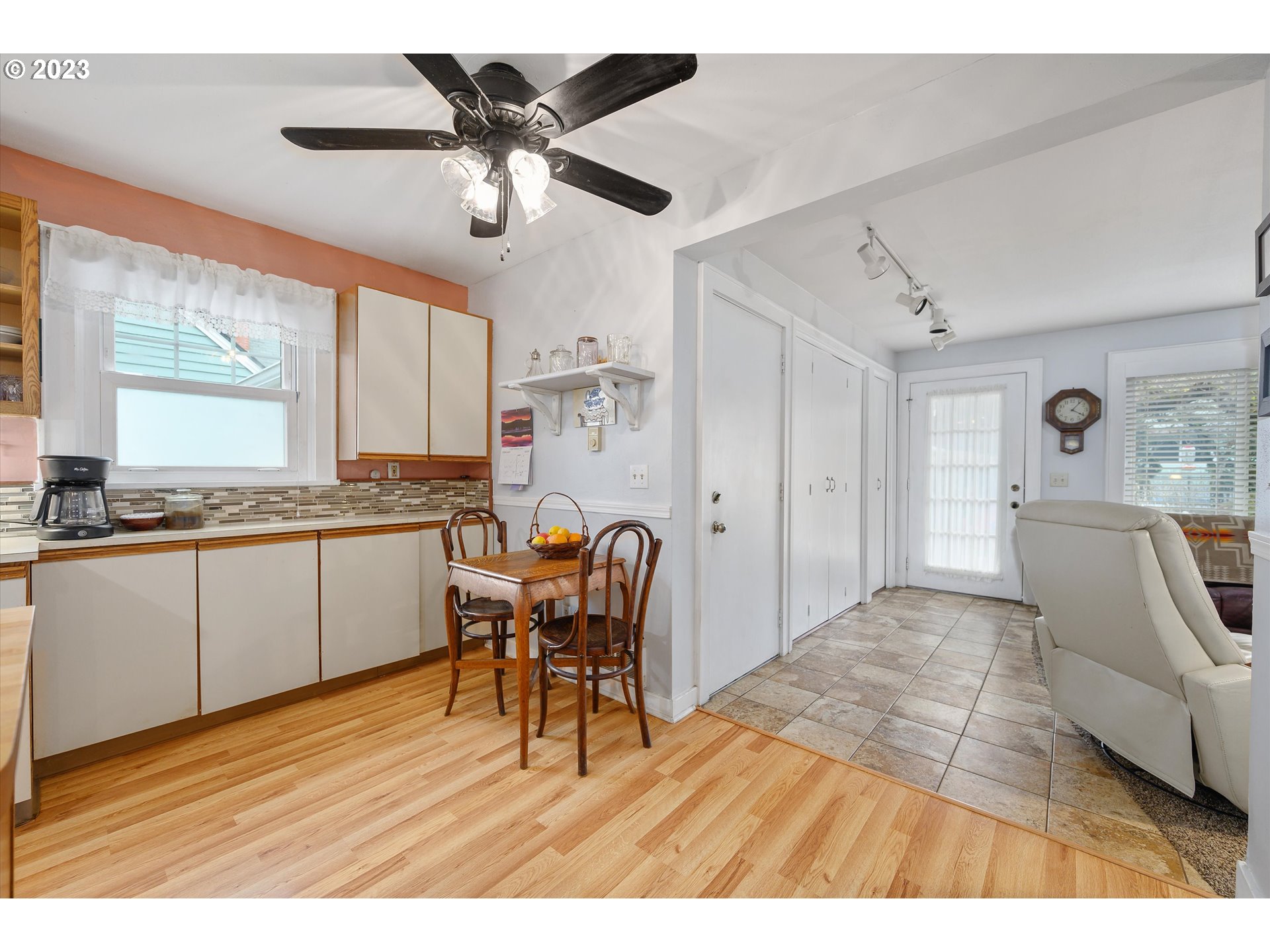 553 Southwest Clay Street Dallas, OR 97338 - Photo 13 of 33 a open kitchen with stainless steel appliances granite countertop a stove top oven a sink a dining table and chairs with wooden floor