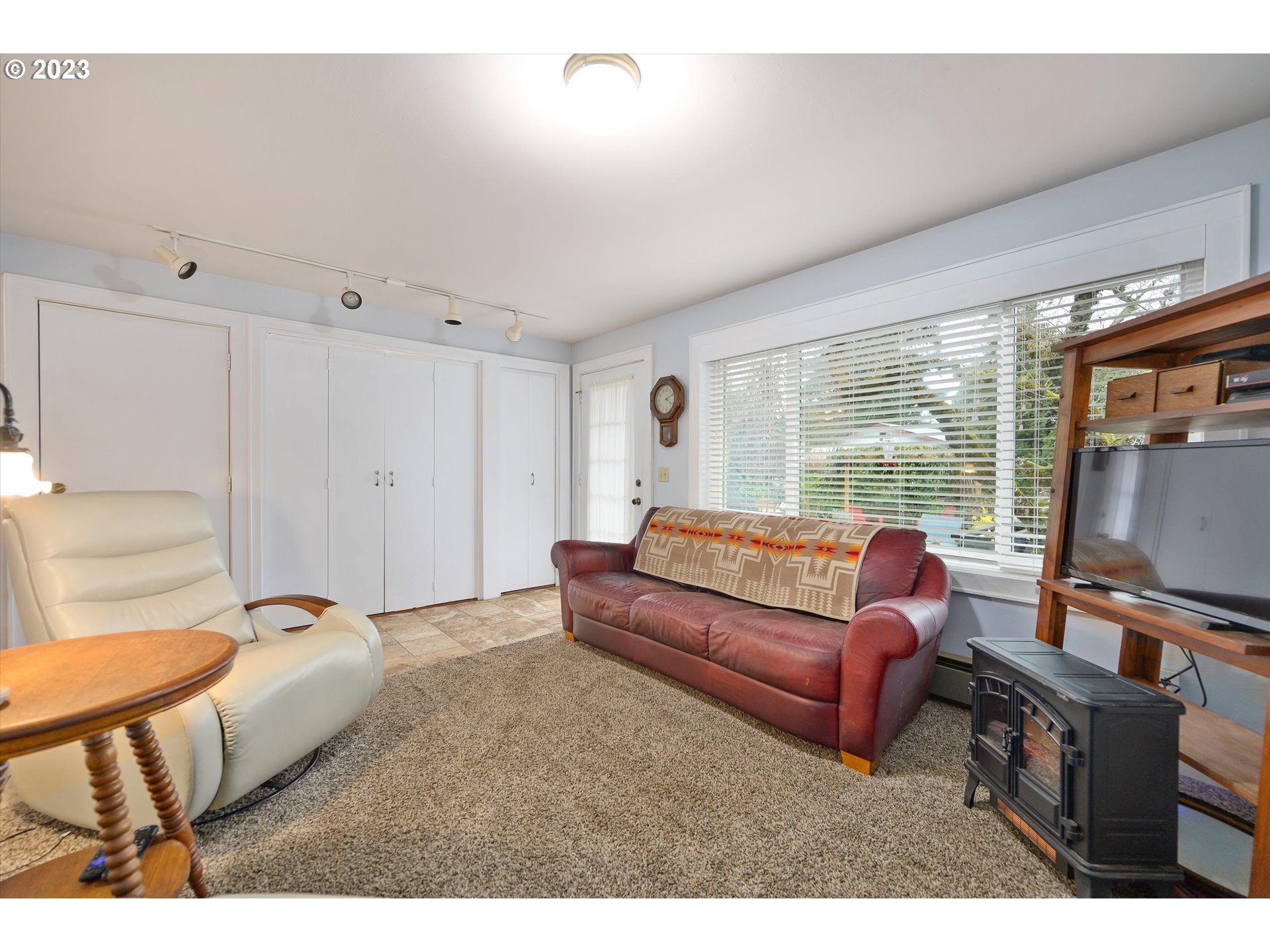 553 Southwest Clay Street Dallas, OR 97338 - Photo 19 of 33 a bedroom with furniture and a flat screen tv