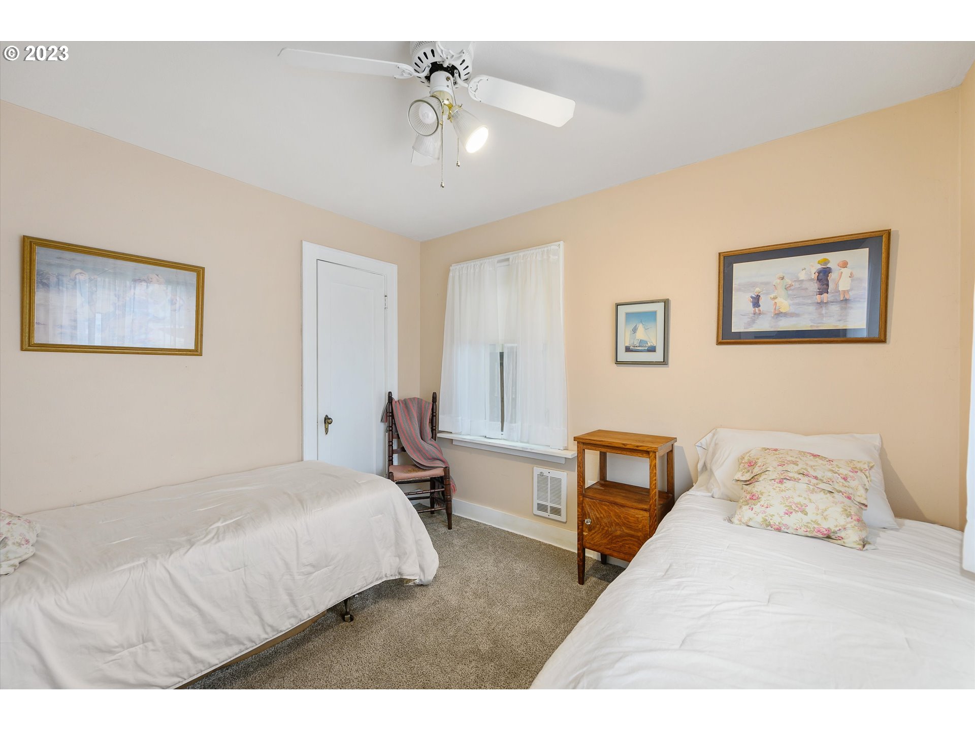 553 Southwest Clay Street Dallas, OR 97338 - Photo 24 of 33 a bedroom with a bed and a chandelier