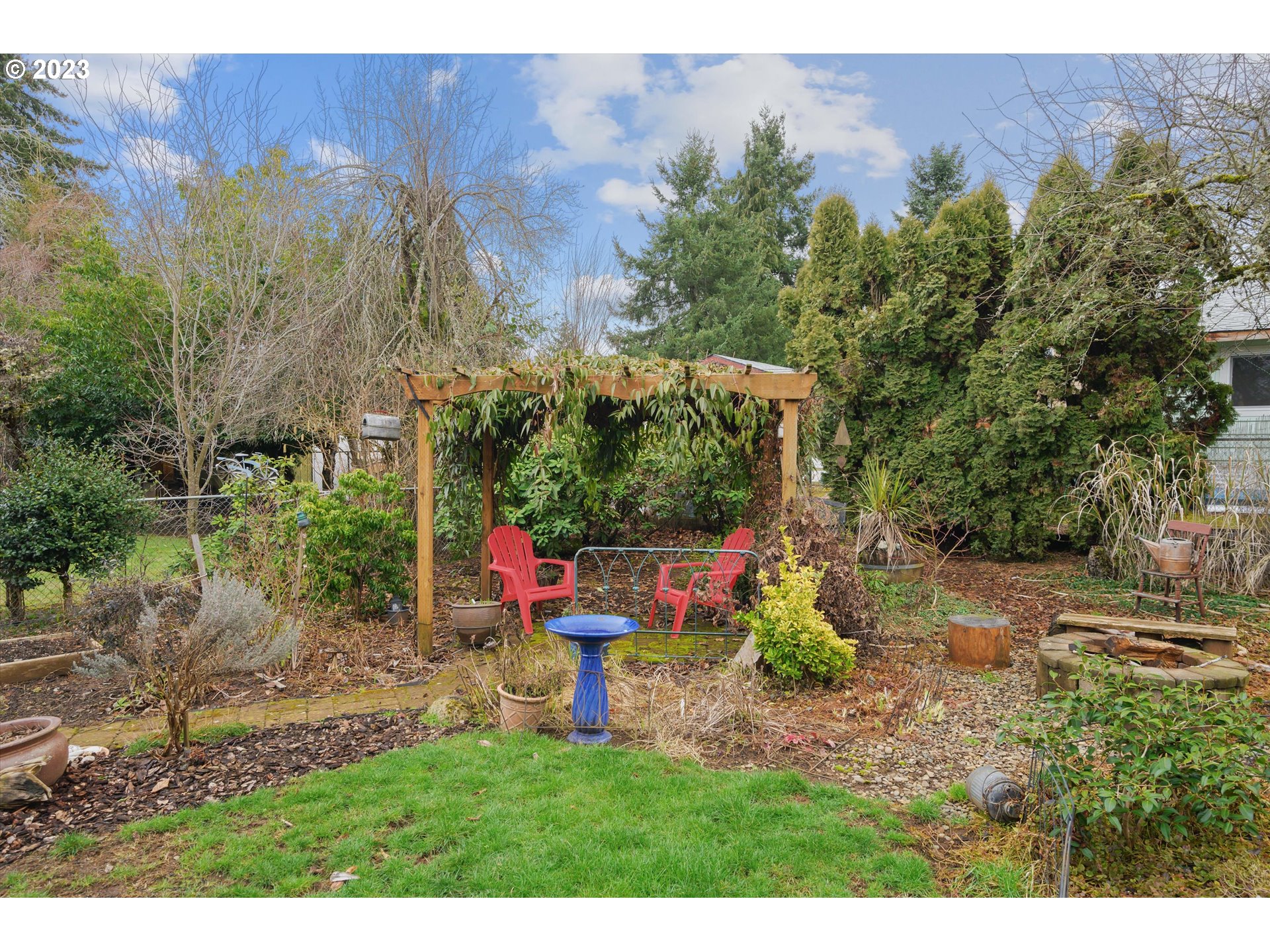 553 Southwest Clay Street Dallas, OR 97338 - Photo 28 of 33 a view of a backyard with plants and a yard