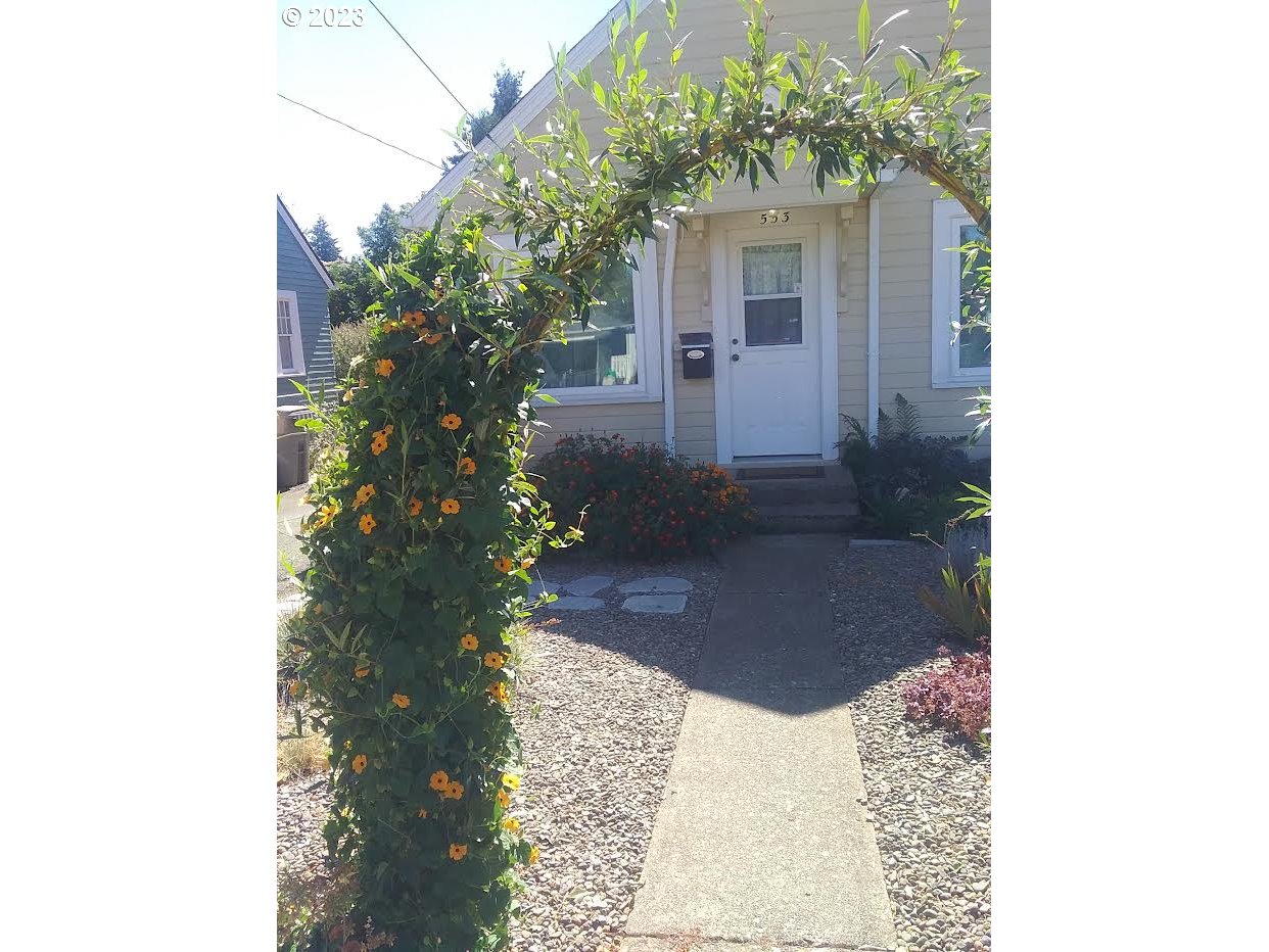 553 Southwest Clay Street Dallas, OR 97338 - Photo 31 of 33 a view of a house with a yard