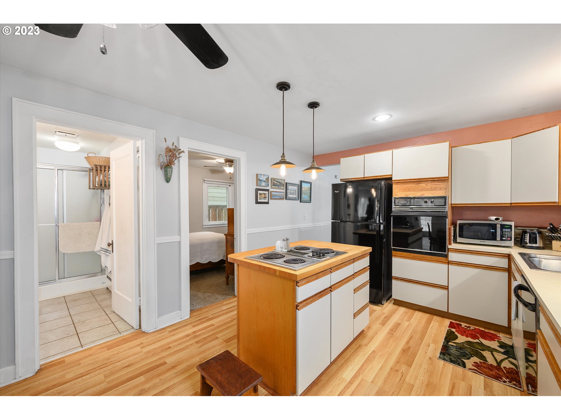 553 Southwest Clay Street Dallas, OR 97338 - Photo 10 of 33 a kitchen with stainless steel appliances granite countertop a stove and a refrigerator
