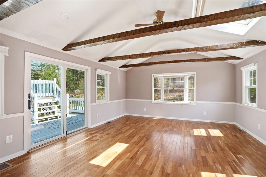 3 Fairway Drive Canton, MA 02021 - Photo 8 of 34 a view of an empty room with wooden floor and a window