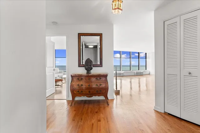 a view of living room with furniture and a fireplace