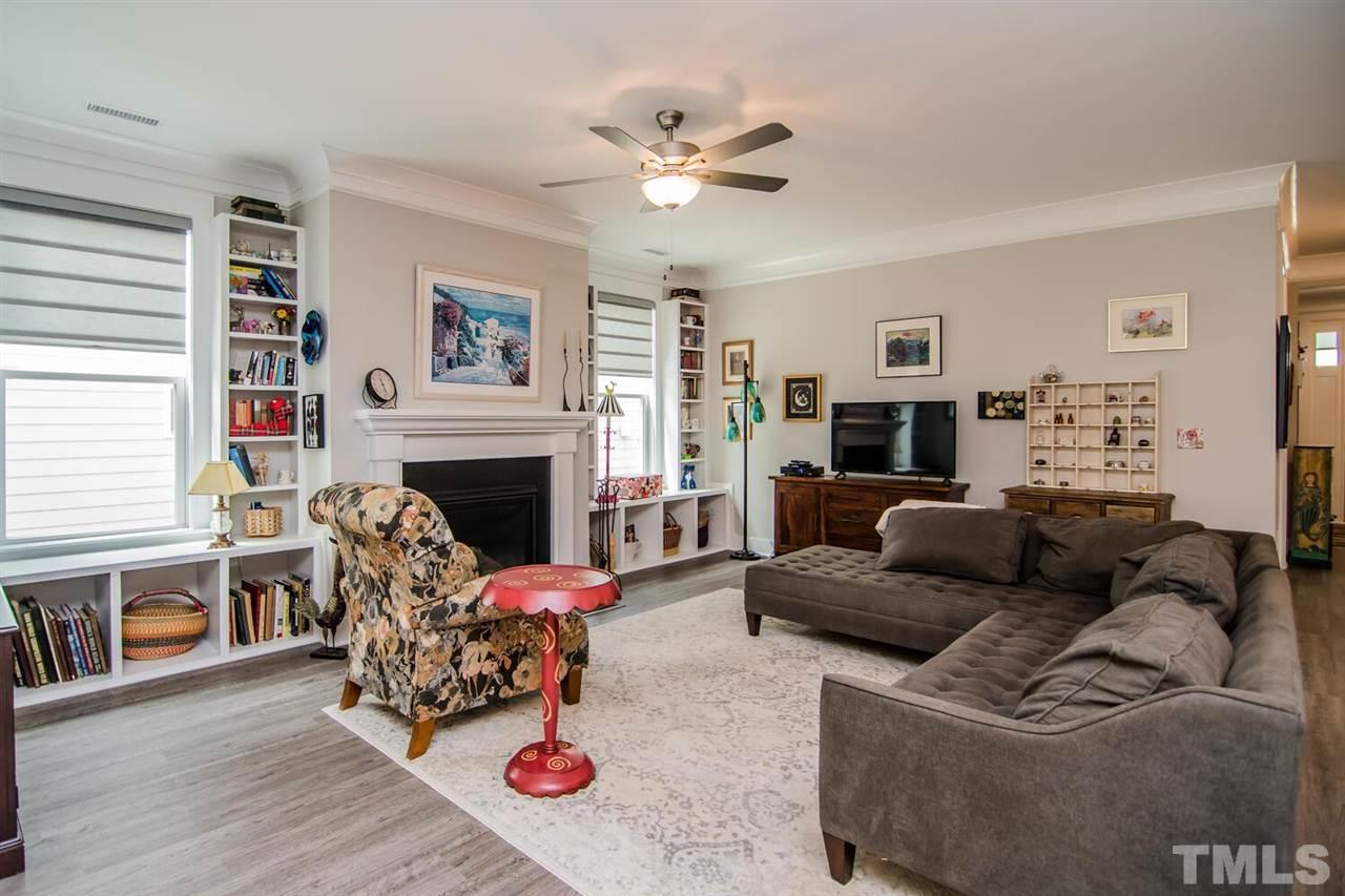 1210 Pondfield Way Durham, NC 27713 - Photo 11 of 29 a living room with furniture a fireplace and a window