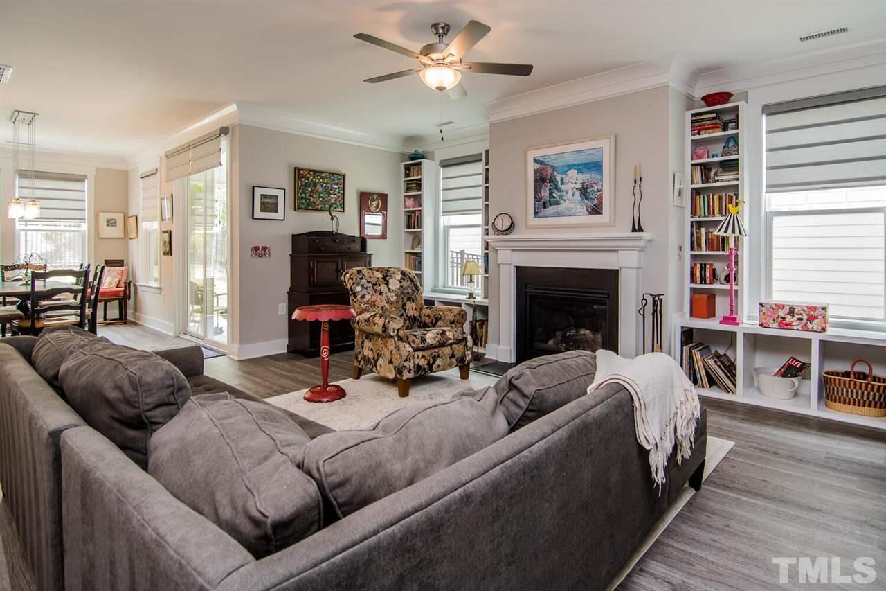 1210 Pondfield Way Durham, NC 27713 - Photo 12 of 29 a living room with furniture a fireplace and a window