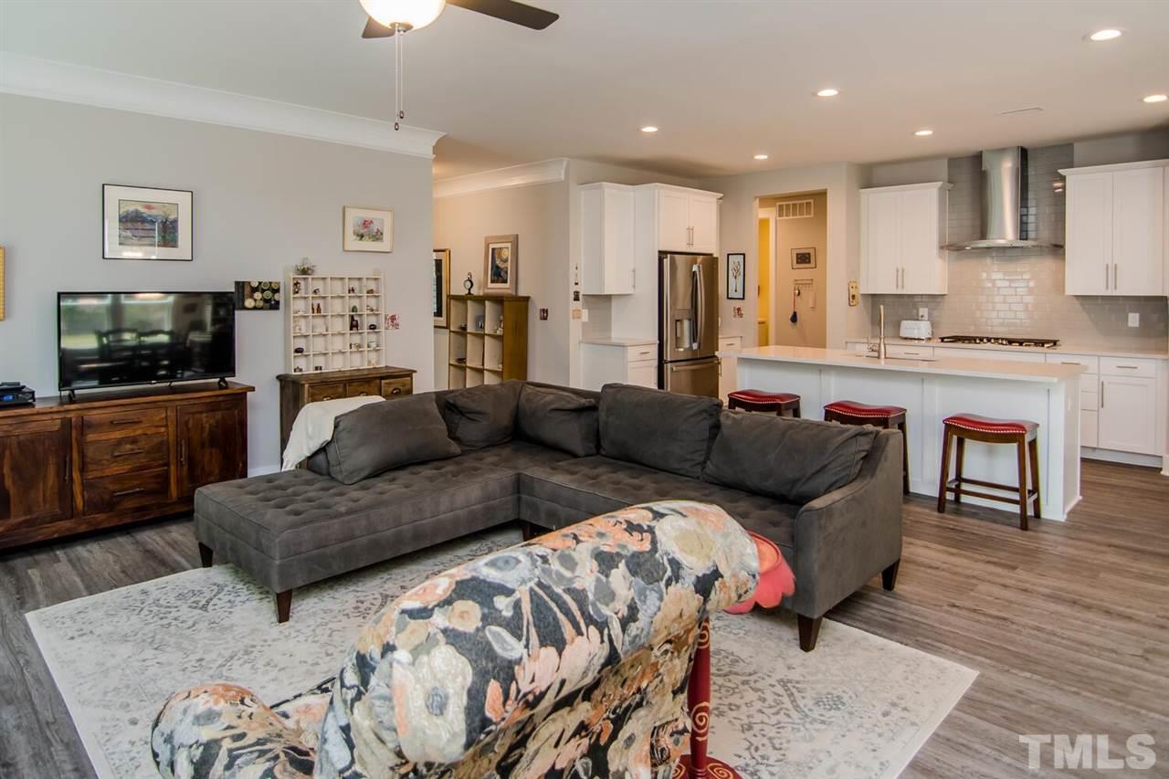 1210 Pondfield Way Durham, NC 27713 - Photo 14 of 29 a living room with a couches and kitchen view