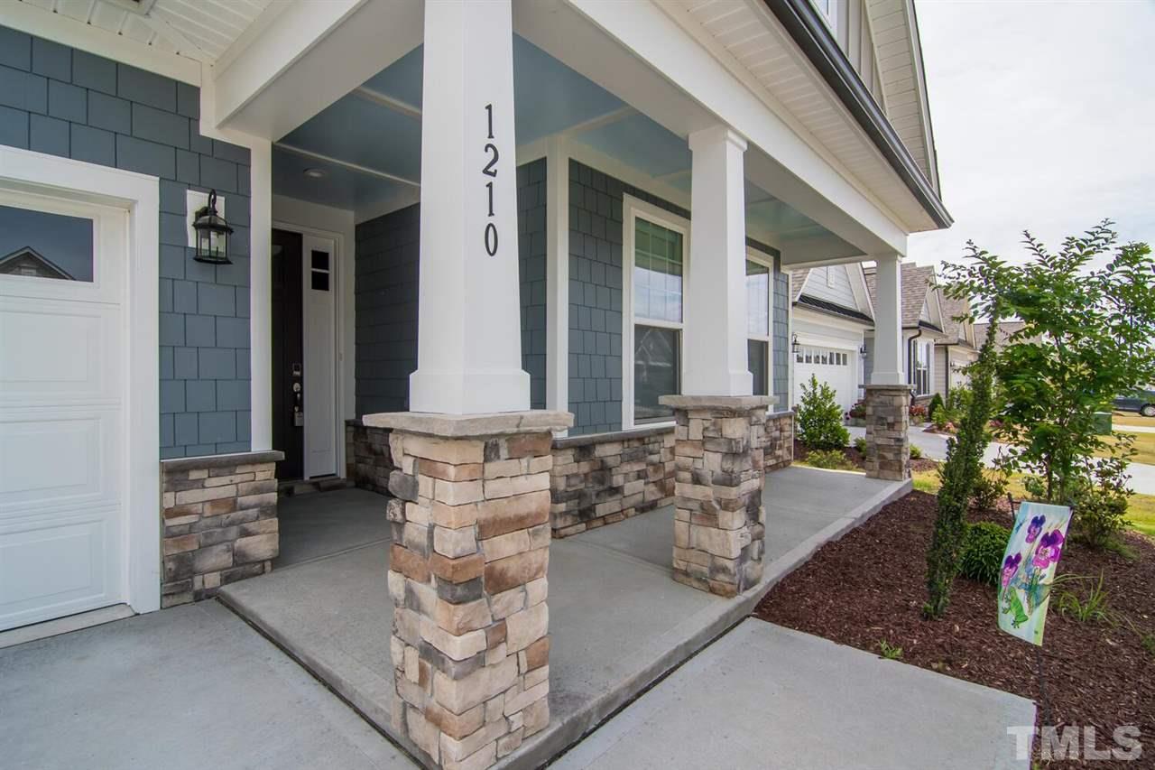 1210 Pondfield Way Durham, NC 27713 - Photo 3 of 29 a view of a house with patio