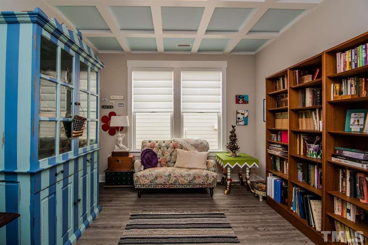 1210 Pondfield Way Durham, NC 27713 - Photo 5 of 29 a living room with furniture and a book shelf