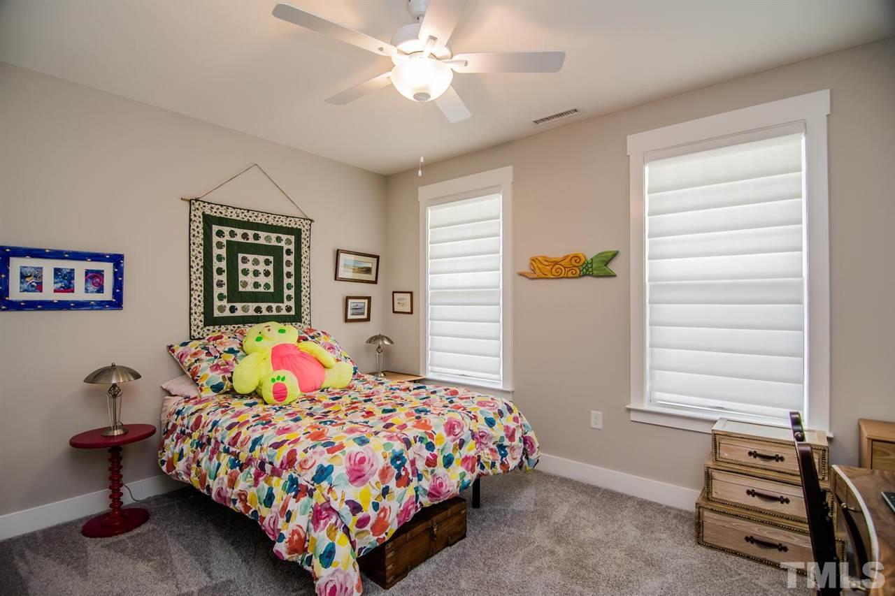 1210 Pondfield Way Durham, NC 27713 - Photo 7 of 29 a bedroom with a bed and a window
