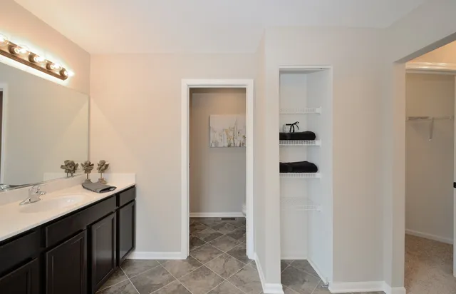 a bathroom with a sink and mirror
