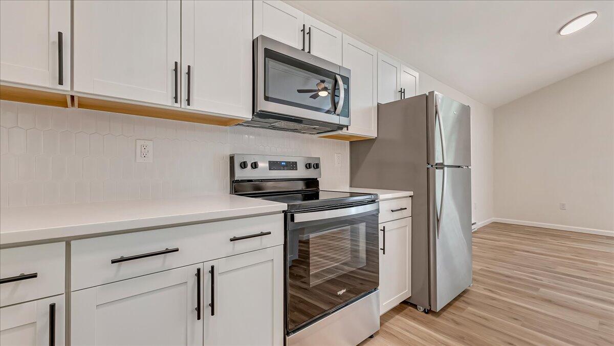 169 Sportsmen Drive Cresco, PA 18326 - Photo 12 of 61 a kitchen with stainless steel appliances granite countertop a refrigerator a stove and a microwave