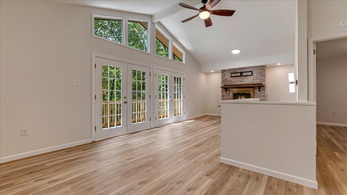 169 Sportsmen Drive Cresco, PA 18326 - Photo 13 of 61 an empty room with wooden floor cabinet and windows
