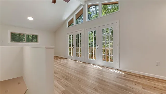 a view of room with wooden floor