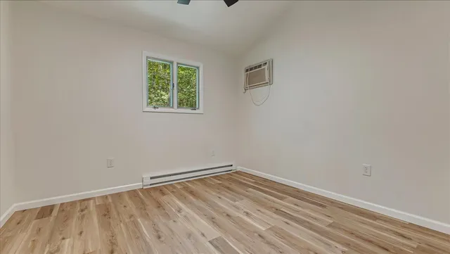 a view of a bathroom with a shower and a tub