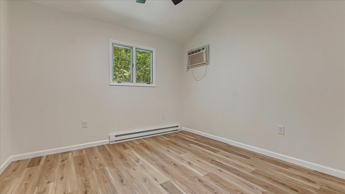 169 Sportsmen Drive Cresco, PA 18326 - Photo 19 of 61 a view of an empty room with wooden floor and a window