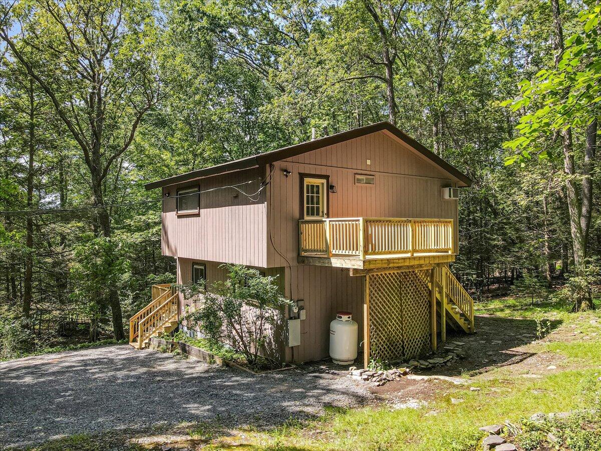 169 Sportsmen Drive Cresco, PA 18326 - Photo 36 of 61 a front view of a house with garden