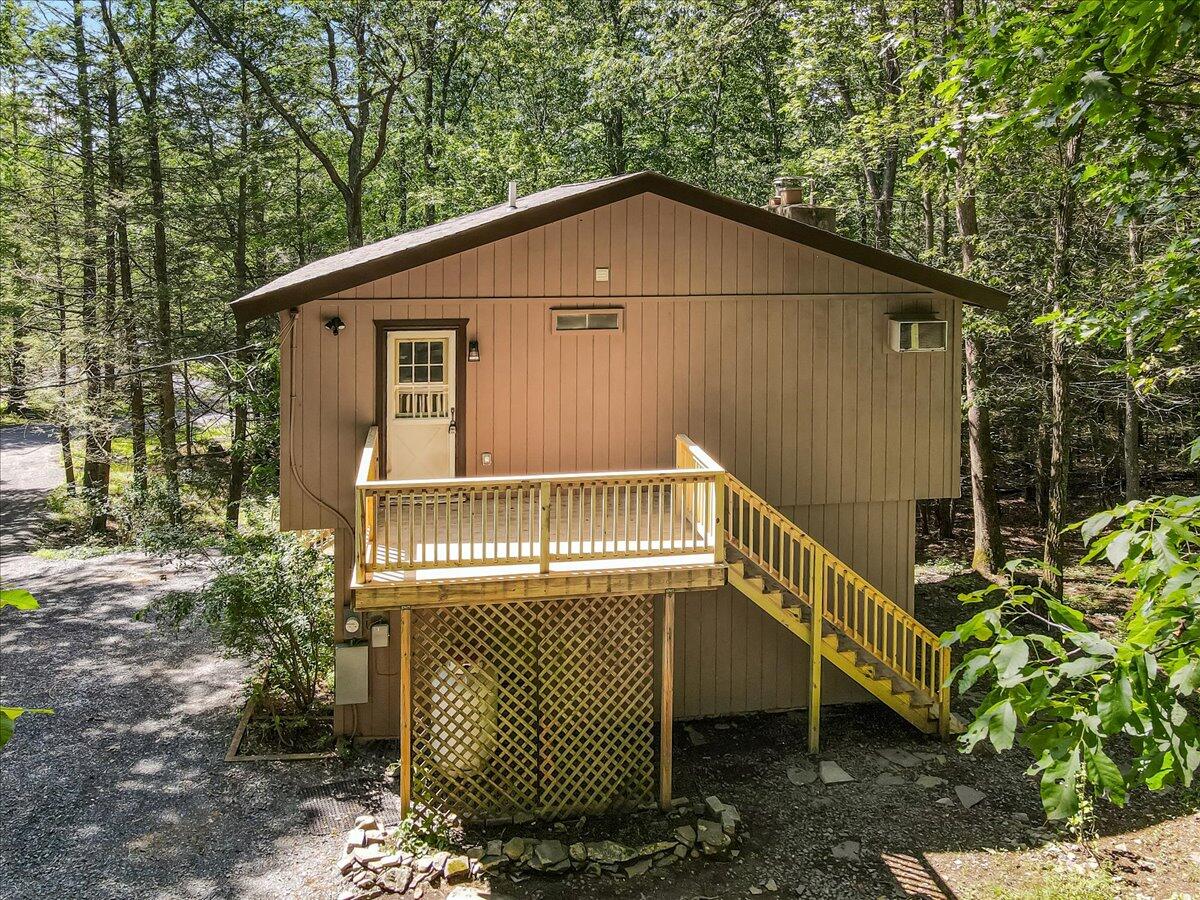 169 Sportsmen Drive Cresco, PA 18326 - Photo 5 of 61 a house with trees in front of it