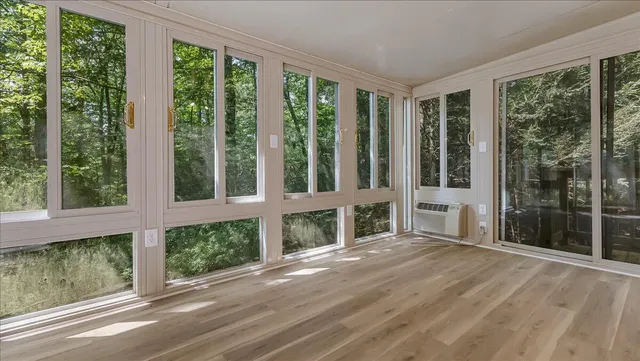 a kitchen with stainless steel appliances white cabinets and a stove top oven