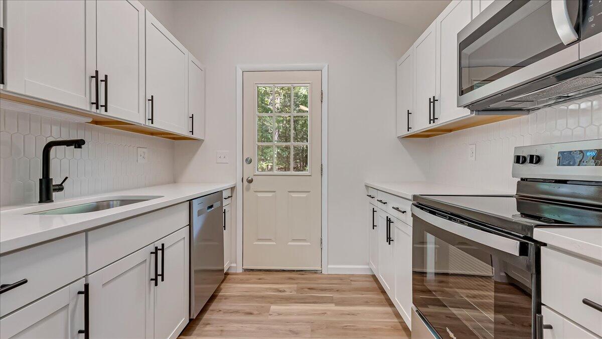 169 Sportsmen Drive Cresco, PA 18326 - Photo 9 of 61 a kitchen with a sink and cabinets