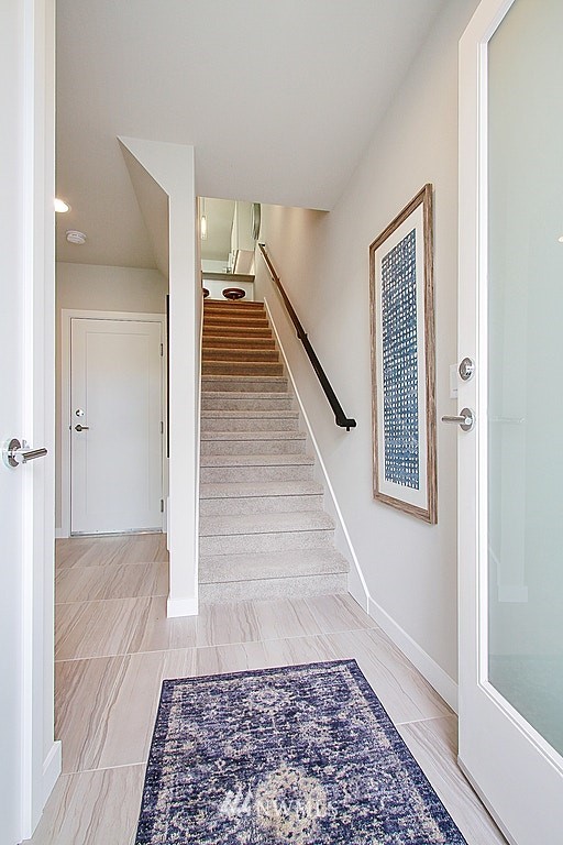 8554 22nd Place Northeast Seattle, WA 98115 - Photo 2 of 25 a view of a hallway with wooden floor and staircase