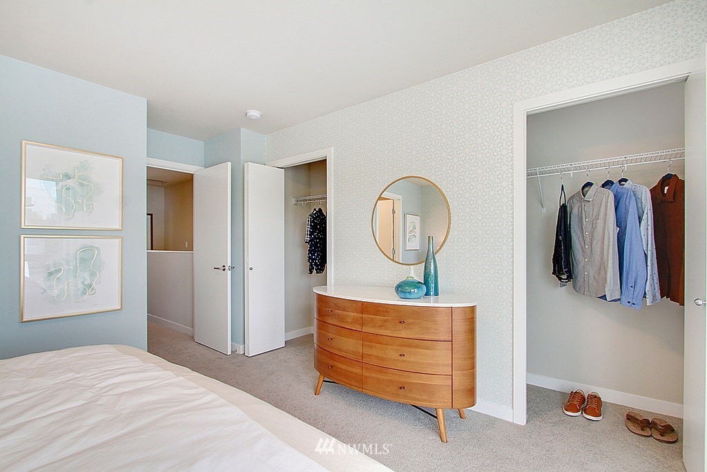 8554 22nd Place Northeast Seattle, WA 98115 - Photo 16 of 25 a bedroom with a bed and a mirror
