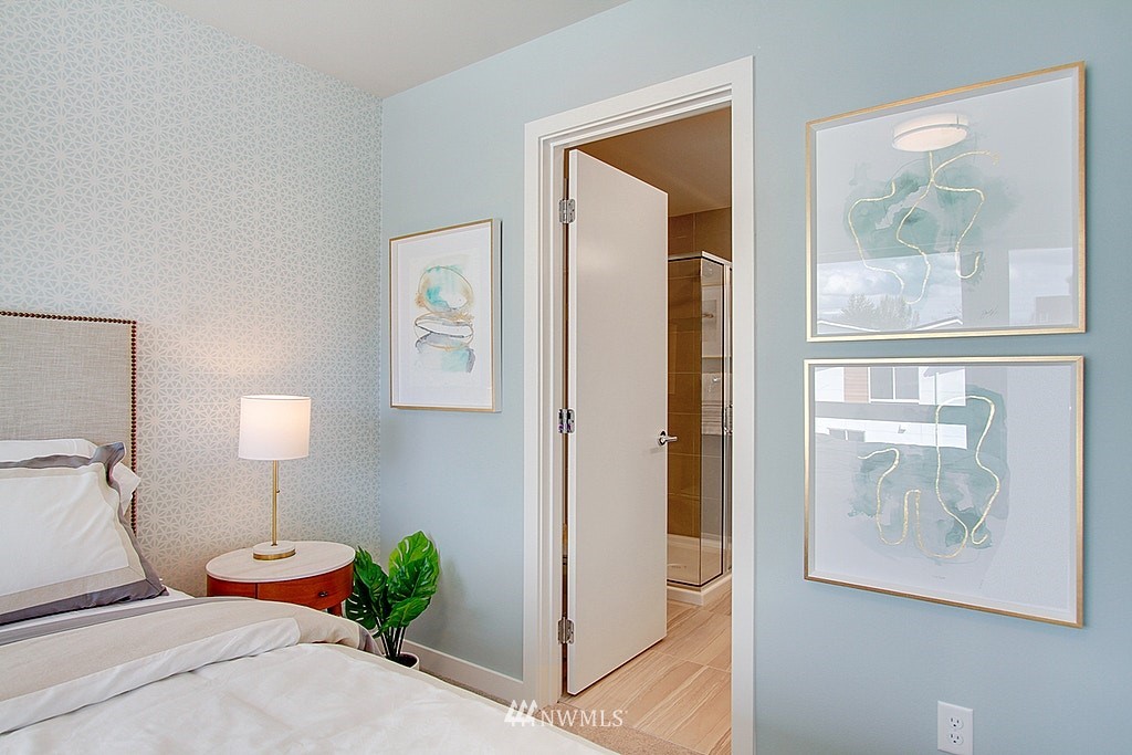 8554 22nd Place Northeast Seattle, WA 98115 - Photo 17 of 25 a bedroom with a bed and a painting on the wall