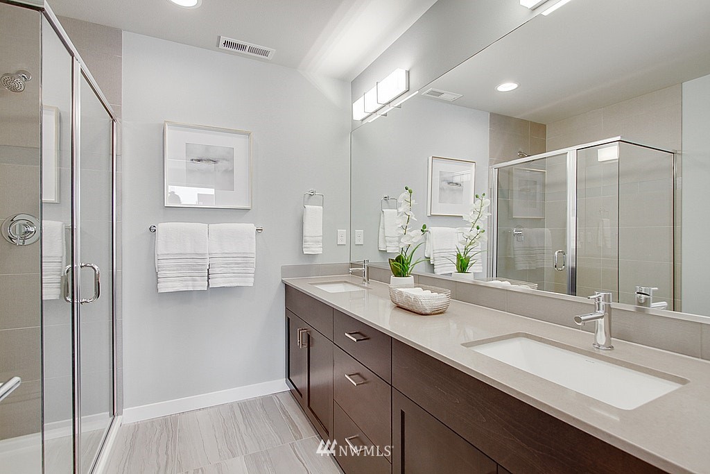 8554 22nd Place Northeast Seattle, WA 98115 - Photo 18 of 25 a bathroom with a double vanity sink mirror and double