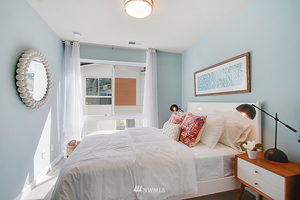 8554 22nd Place Northeast Seattle, WA 98115 - Photo 19 of 25 a bedroom with a bed and a window