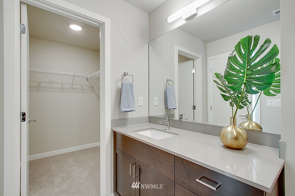 8554 22nd Place Northeast Seattle, WA 98115 - Photo 22 of 25 a bathroom with a sink a vanity and a mirror