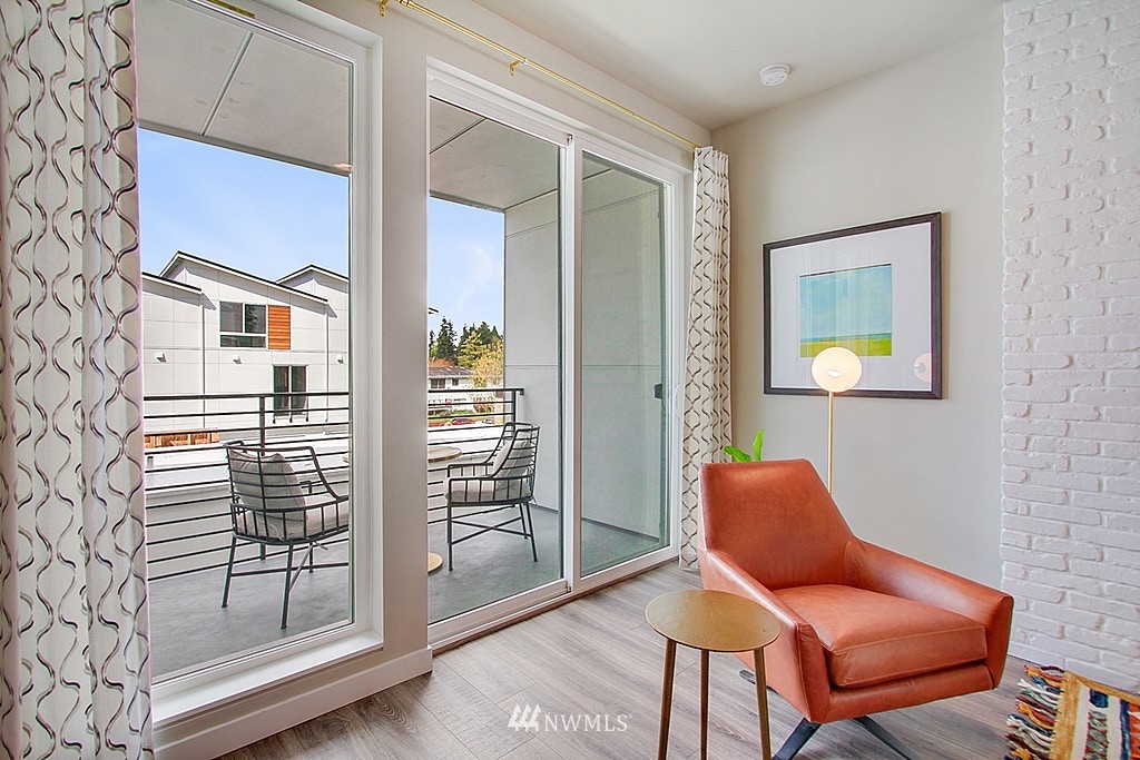 8554 22nd Place Northeast Seattle, WA 98115 - Photo 6 of 25 a chair and a table in a room