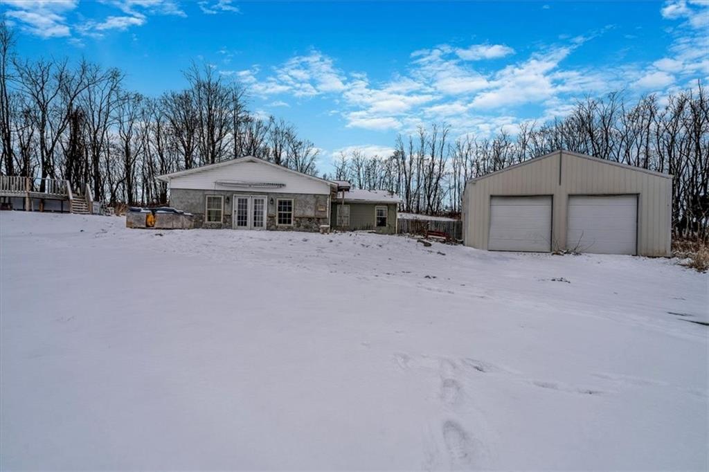 a view of a house with a snow in the yard