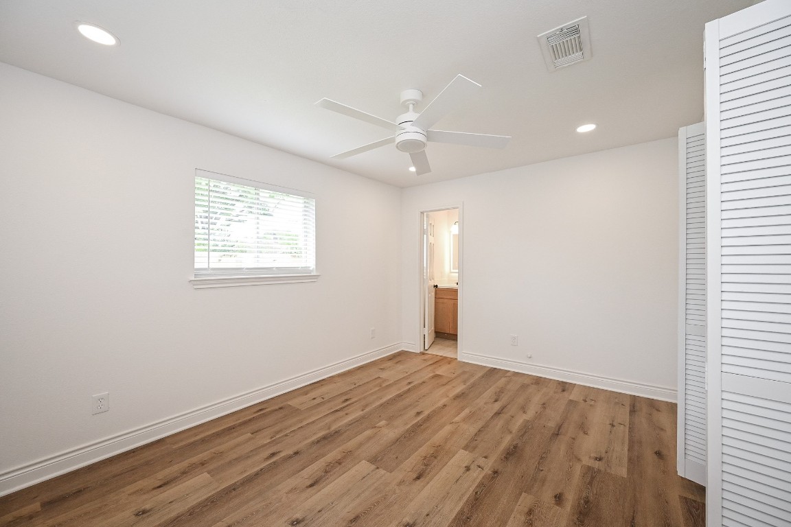 11027 Maize Lane Houston, TX 77041 - Photo 15 of 32 wooden floor in an empty room with a window