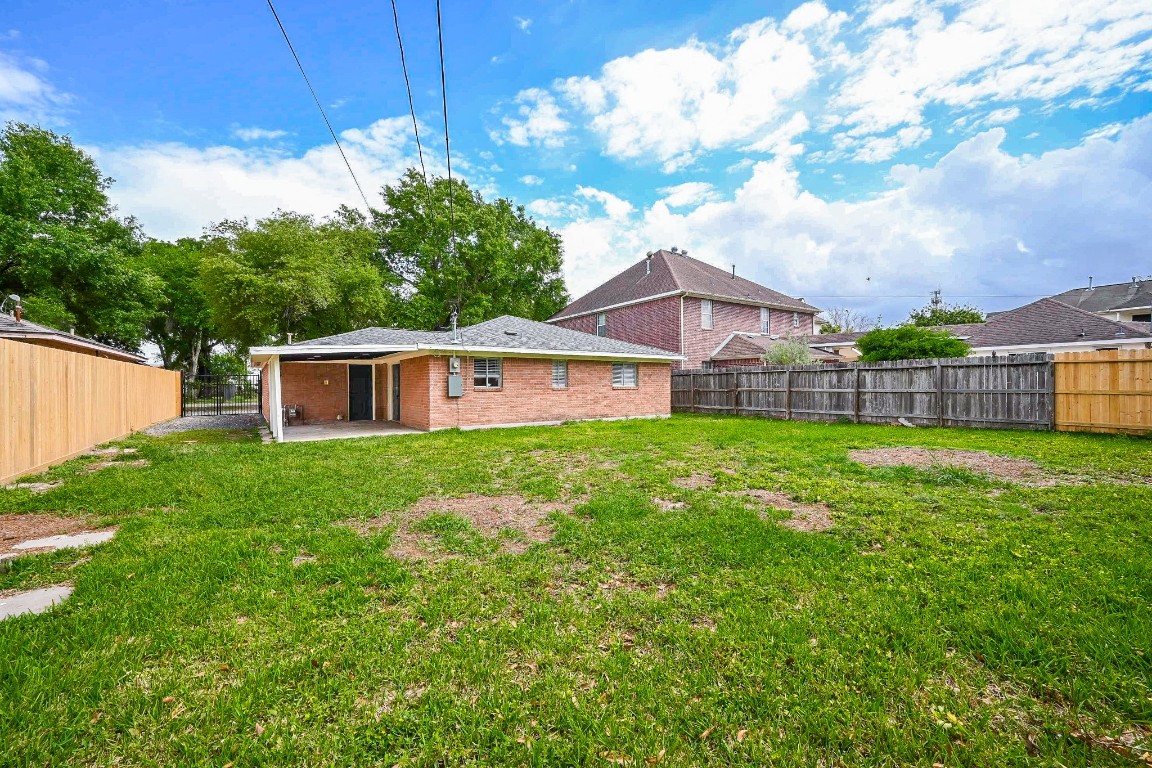 11027 Maize Lane Houston, TX 77041 - Photo 29 of 32 a front view of house with yard and trees in the background