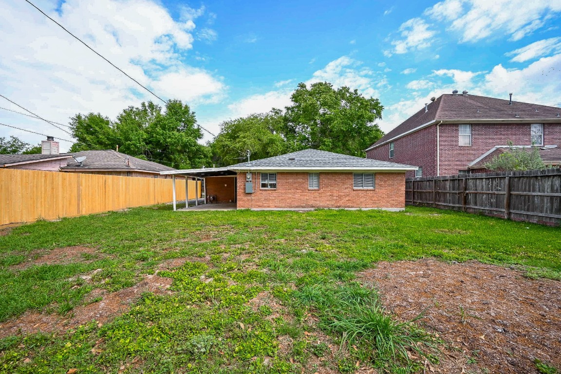 11027 Maize Lane Houston, TX 77041 - Photo 30 of 32 a view of a house with a yard and a large tree