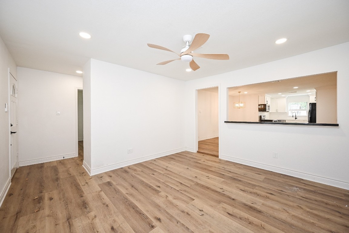 11027 Maize Lane Houston, TX 77041 - Photo 4 of 32 a view of a kitchen with a sink and cabinet with wooden floor