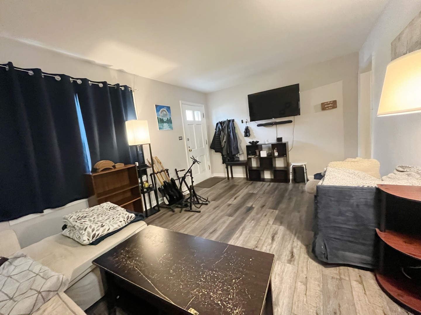 2950 Des Plaines Avenue, Unit 2950 North Riverside, IL 60546 - Photo 2 of 11 a living room with furniture and a flat screen tv