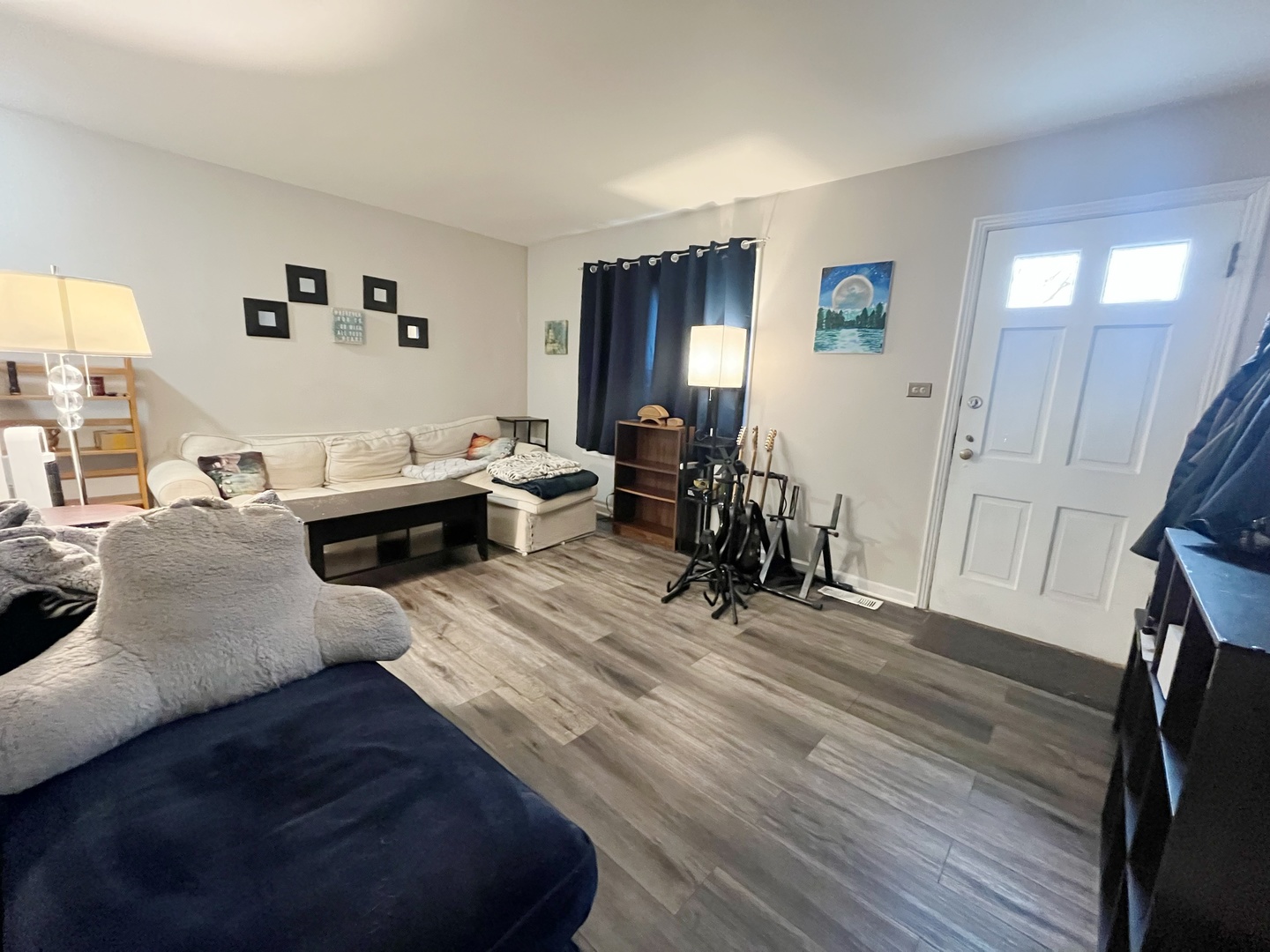 2950 Des Plaines Avenue, Unit 2950 North Riverside, IL 60546 - Photo 3 of 11 a living room with furniture and a wooden floor