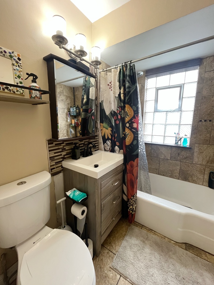 2950 Des Plaines Avenue, Unit 2950 North Riverside, IL 60546 - Photo 9 of 11 a bathroom with a sink a toilet and shower