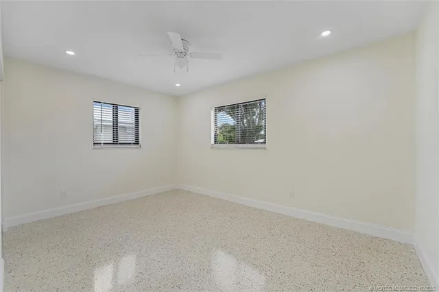 an empty room with windows