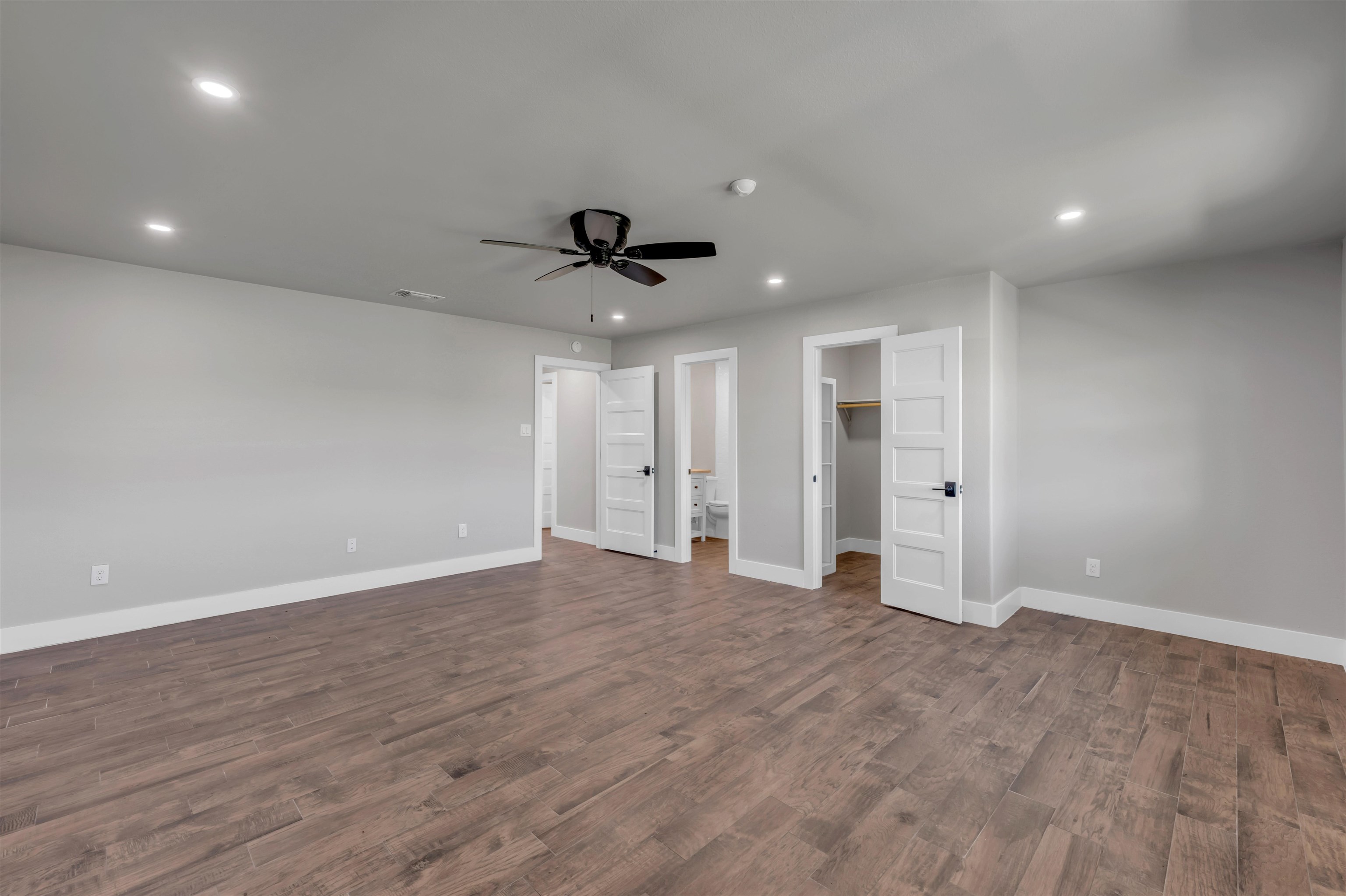 941 County Road 402 Marble Falls, TX 78654 - Photo 22 of 30 a view of an empty room with wooden floor and a ceiling fan
