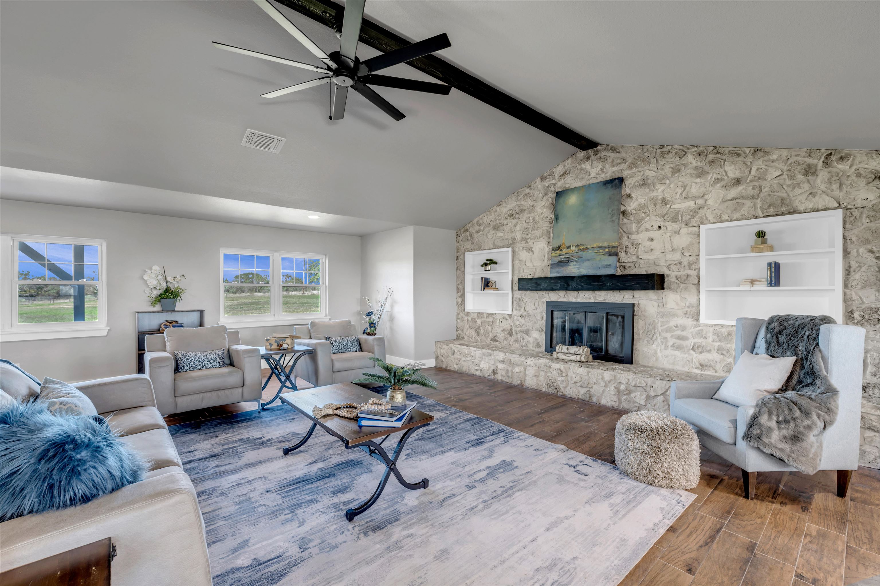 941 County Road 402 Marble Falls, TX 78654 - Photo 5 of 30 a living room with furniture and a fireplace