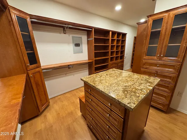 a view of a workspace with bookshelf