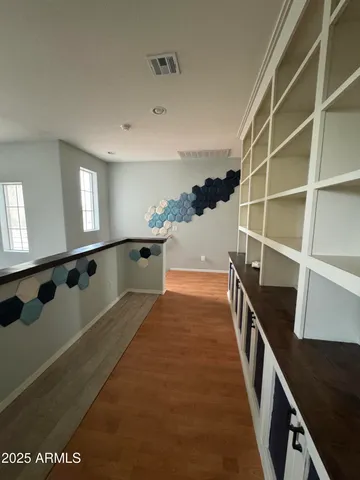 a bathroom with a granite countertop sink a toilet a mirror and shower