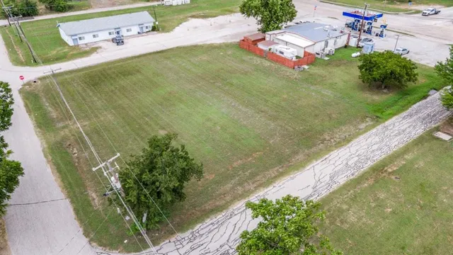 a view of a swimming pool with a yard