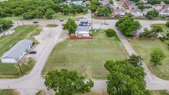 a view of a swimming pool with a yard